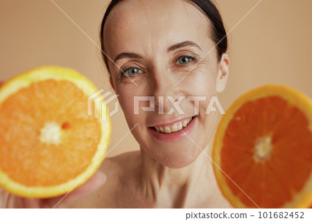 happy modern woman against beige background happy modern woman against beige background 101682452