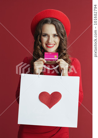 happy elegant woman in dress and beret isolated on background happy elegant woman in dress and beret isolated on background 101682794