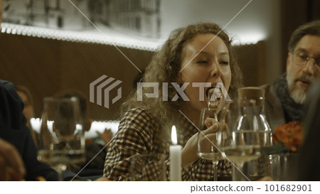 Woman celebrates birthday with friends in cafe Woman celebrates birthday with friends in cafe 101682901