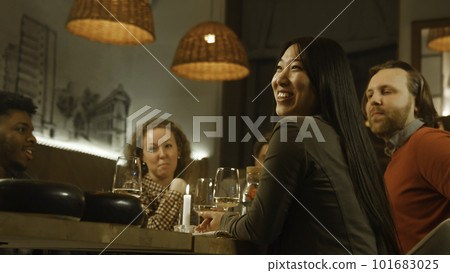 Cheerful multi ethnic friends in modern cafe 101683025