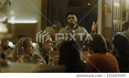 African American man says toast on birthday party in cafe 101683045