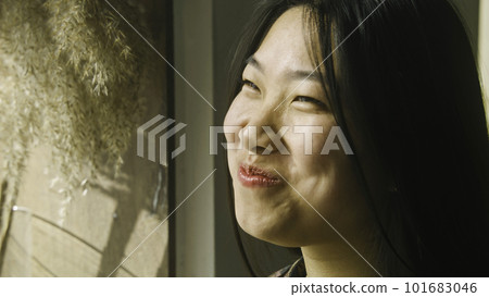 Asian woman eats in cafe with modern cuisine 101683046
