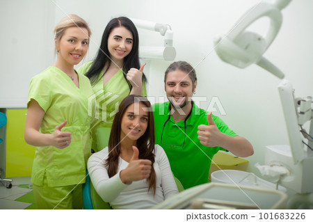 Portrait of smiling dentists in dental clinic 101683226