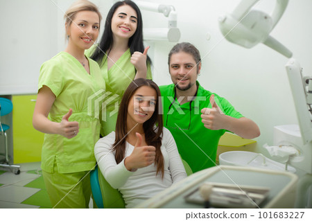 Portrait of smiling dentists in dental clinic 101683227