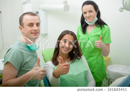 Portrait of smiling dentists in dental clinic 101683451