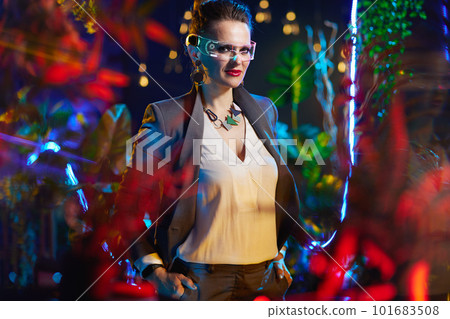 Portrait of trendy 40 years old business woman in metaverse 101683508