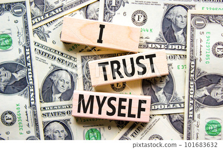 I trust myself symbol. Concept words I trust myself on wooden blocks. Dollar bills. Beautiful background from dollar bills. Business, psychological and I trust myself concept. Copy space. 101683632