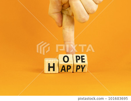 Hope and happy symbol. Concept words Hope and Happy on wooden cubes. Beautiful orange table orange background. Businessman hand. Business hope and happy concept. Copy space. Hope and happy symbol. Concept words Hope and Happy on wooden cubes. Beautiful orange table orange background. Businessman hand. Business hope and happy concept. Copy space. 101683695