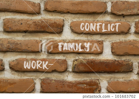 Work-family conflict symbol. Concept words Work-family conflict on red brown brick wall on beautiful red brown brick wall background. Business work-family conflict concept. Copy space. Work-family conflict symbol. Concept words Work-family conflict on red brown brick wall on beautiful red brown brick wall background. Business work-family conflict concept. Copy space. 101683702