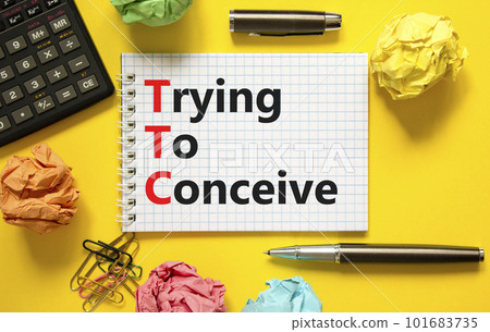 TTC trying to conceive symbol. Concept words TTC trying to conceive on white note on a beautiful yellow background. Black pen. Medical and TTC trying to conceive concept. Copy space. TTC trying to conceive symbol. Concept words TTC trying to conceive on white note on a beautiful yellow background. Black pen. Medical and TTC trying to conceive concept. Copy space. 101683735