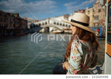 pensive young traveller woman in floral dress with hat pensive young traveller woman in floral dress with hat 101684496