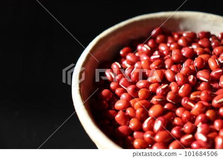 Adzuki beans in a bowl on a black background (partial) Adzuki beans in a bowl on a black background (partial) 101684506