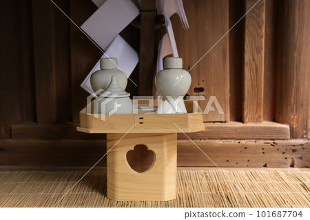 Offer of sacred sake 101687704