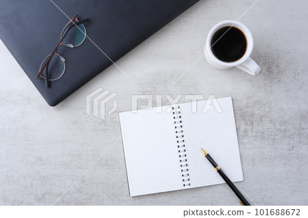 Image of spreading a laptop and notebook on a desk and doing desk work while drinking coffee 101688672