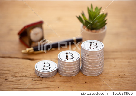 Money (bitcoin) stacked on the table 101688969