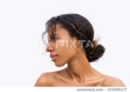 Beauty portrait of young topless african american woman with bare shoulders on white background with perfect skin and natural makeup positive Beauty portrait of young topless african american woman with bare shoulders on white background with perfect skin and natural makeup positive 101690227