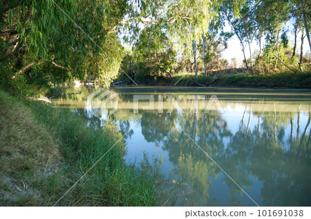 Beautiful river with trees reflected on the water in Kakadu National Park Beautiful river with trees reflected on the water in Kakadu National Park 101691038