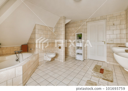 a bathroom that is in someone's house, with the toilet and bathtub next to it on the floor 101693759