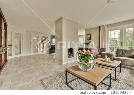 a living room with couches, coffee table, and fireplace in the middle part of the room is empty a living room with couches, coffee table, and fireplace in the middle part of the room is empty 101693864