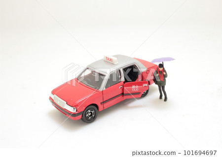 a figure order the taxi at rain day a figure order the taxi at rain day 101694697