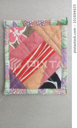 Colorful handmade textiles. Colored fabric patchwork background. Patchwork background. Multicolored patchwork knitted background. 101694835