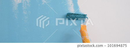 Professional decorator painting wall in blue color. Professional decorator painting wall in blue color. 101694875