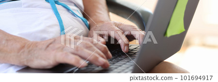 Old woman working or searching information on modern laptop Old woman working or searching information on modern laptop 101694917
