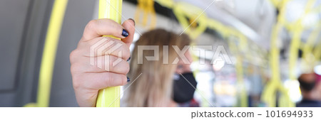 Woman hand holding handrail in tram or bus Woman hand holding handrail in tram or bus 101694933