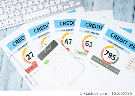 The Credit score report document and pen with calculator on the desk. The Credit score report document and pen with calculator on the desk. 101695720