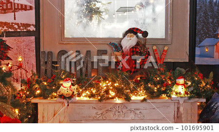 Christmas decoration in the house. Santa Claus, Christmas garlands, tinsel Christmas decoration in the house. Santa Claus, Christmas garlands, tinsel 101695901