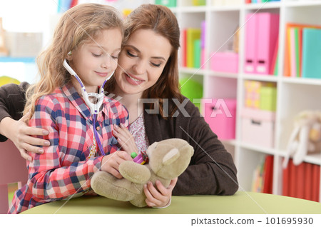 Cute little girl playing nurse Cute little girl playing nurse 101695930