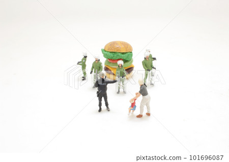 the police officer stops a kid from reaching a burger the police officer stops a kid from reaching a burger 101696087