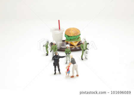 the police officer stops a kid from reaching a burger the police officer stops a kid from reaching a burger 101696089