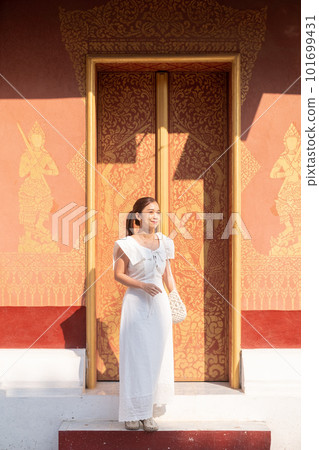 Young Asian Woman at Wat Sene Souk Haram ,Luang Prabang, LAOS 101699431