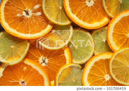 Background of round cut citrus fruits orange and lemon Background of round cut citrus fruits orange and lemon 101700459