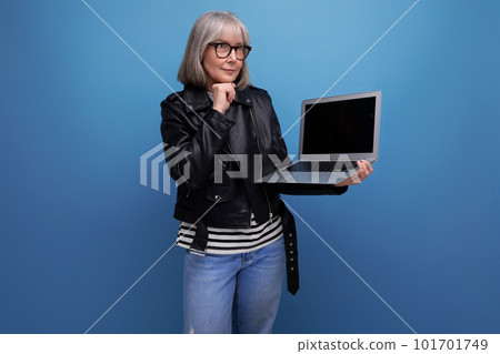smart 60s mature old business woman with gray hair using laptop with mockup on bright background smart 60s mature old business woman with gray hair using laptop with mockup on bright background 101701749