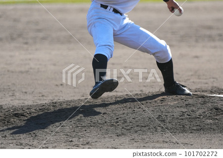 The moment a pitcher throws a ball during a baseball game The moment a pitcher throws a ball during a baseball game 101702272