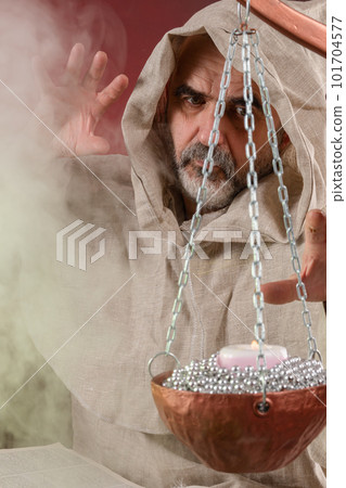 The old sorcerer casts magic spells The old sorcerer casts magic spells 101704577