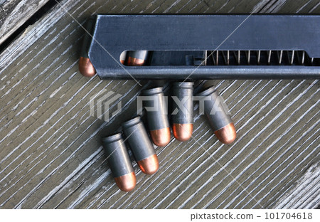 Pistol Cartridges On Wood Pistol Cartridges On Wood 101704618