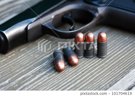Bullets Near Handgun 101704619