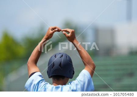 A runner coach giving an OK sign to a batter or runner who showed good play during a baseball game A runner coach giving an OK sign to a batter or runner who showed good play during a baseball game 101705480
