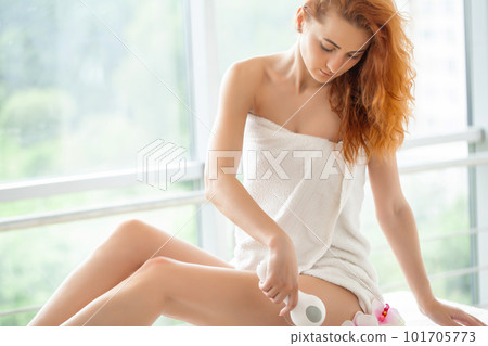 Woman getting anti-cellulite and anti-fat therapy at home Woman getting anti-cellulite and anti-fat therapy at home 101705773