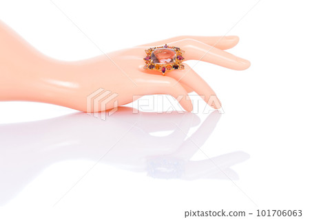 Citrine and Tourmaline Jewel or gems ring on plastic mannequin female finger. Collection of natural gemstones accessories. Studio shot Citrine and Tourmaline Jewel or gems ring on plastic mannequin female finger. Collection of natural gemstones accessories. Studio shot 101706063
