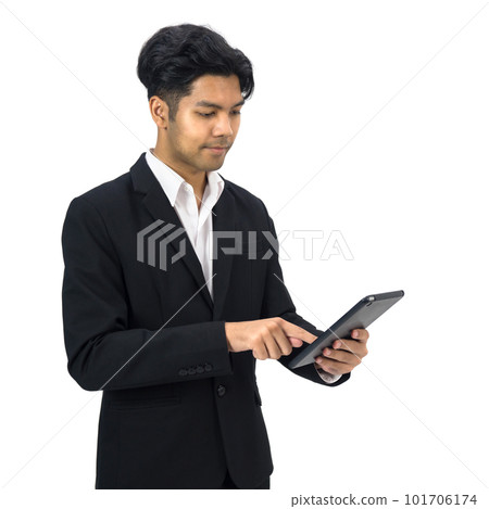 Young asian businessman in white shirt and black suit typing on tablet computer. Portrait on white background with studio light. Young asian businessman in white shirt and black suit typing on tablet computer. Portrait on white background with studio light. 101706174