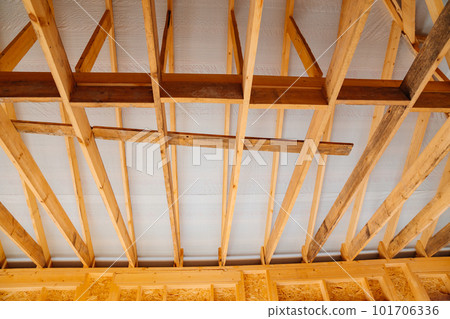 wooden beams inside the house under construction. roof construction. 101706336