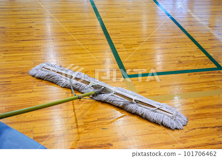 Floor mopping before a court set up basketball game 101706462