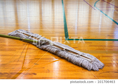 Floor mopping before a court set up basketball game 101706463