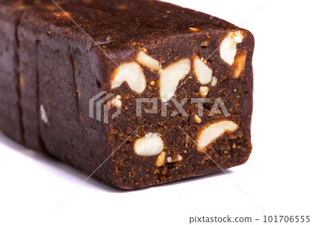 Raw pressed date with nuts and fruit bars isolated on white background. Healthy gluten free snack for energy and diet Raw pressed date with nuts and fruit bars isolated on white background. Healthy gluten free snack for energy and diet 101706555