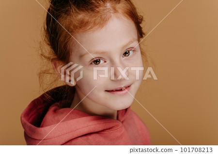 Portrait of little redhead girl, studio shoot. 101708213