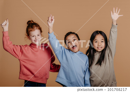 Portrait of three excited children, studio shoot. Concept of diversity in friendship. Portrait of three excited children, studio shoot. Concept of diversity in friendship. 101708217